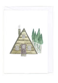 Illustration of a triangle-shaped cabin with trees in the background on a white card.