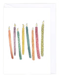 Greeting card with colorful birthday candles on a white background