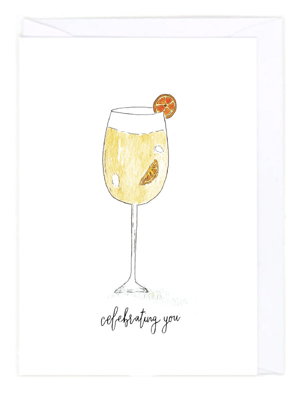 Watercolor Illustration of a glass of Aperol Spritz with an orange twist on a white background, accompanied by the text 'celebrating you'.