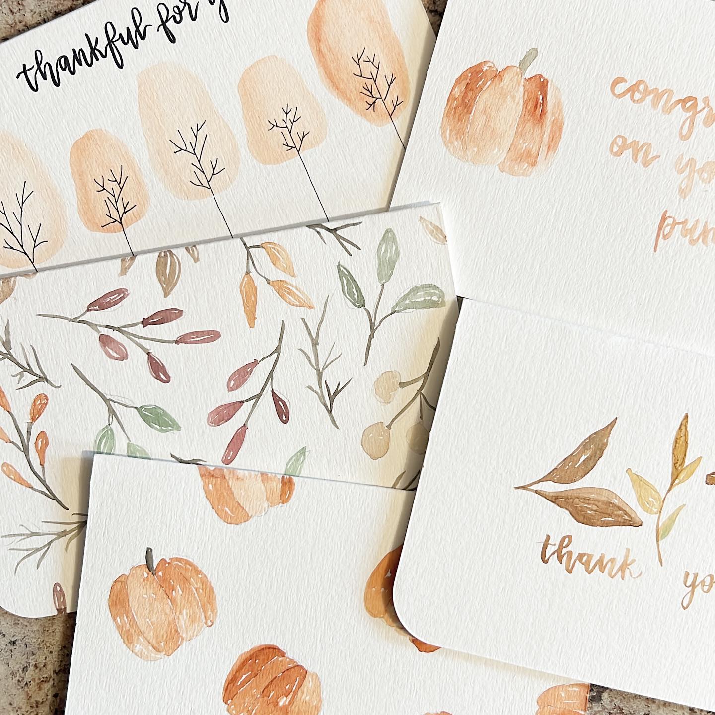 Collection of fall-themed hand-painted greeting cards with various designs.