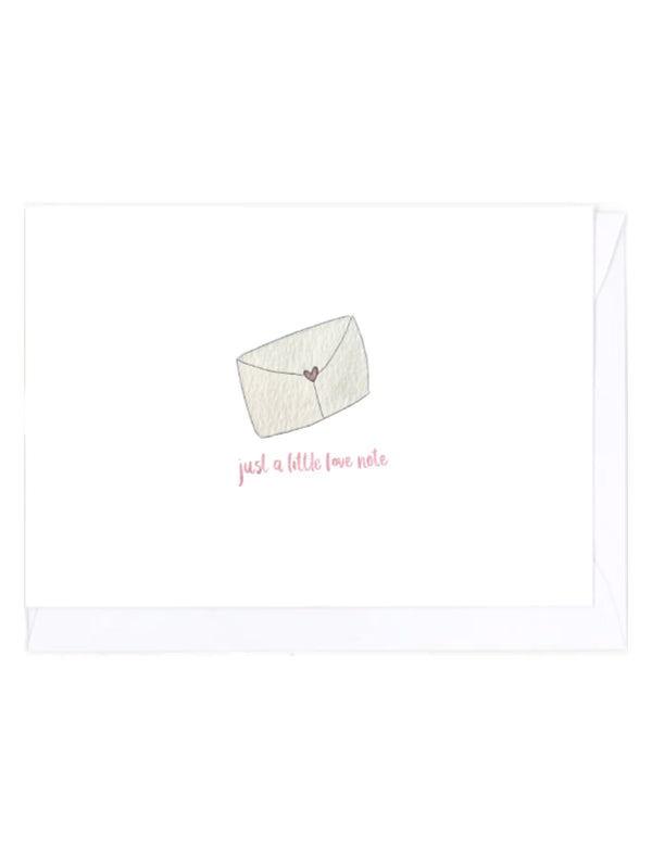 Card with an illustration of a white envelope with pink heart and text 'just a little love note' on a white background