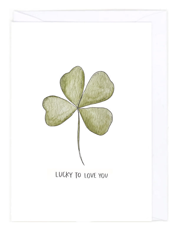 Greeting card with a four-leaf clover illustration with 'Lucky to Love You' text on a white background