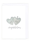 Card with two heart shapes labeled 'Mr' and 'Mrs' and the text 'Congratulations' on a white background.