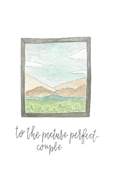 Framed illustration of a mountain landscape with text 'to the picture perfect couple' on a white background