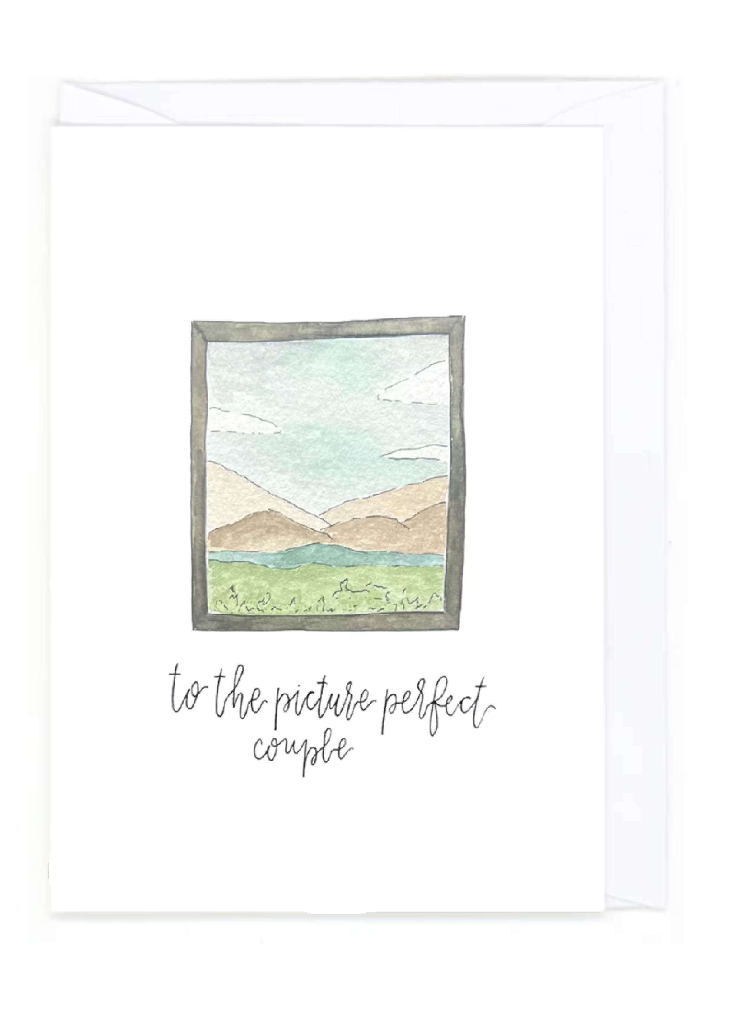 Framed artwork with a mountain landscape and text 'to the picture perfect couple' on a white background