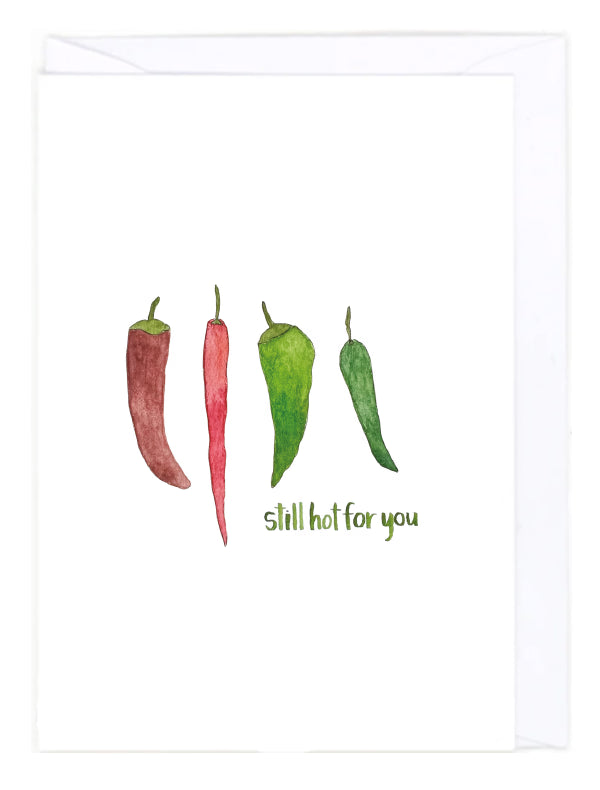 Greeting card with an illustration of four chilli peppers in red and green on a white background with the text 'still hot for you'.