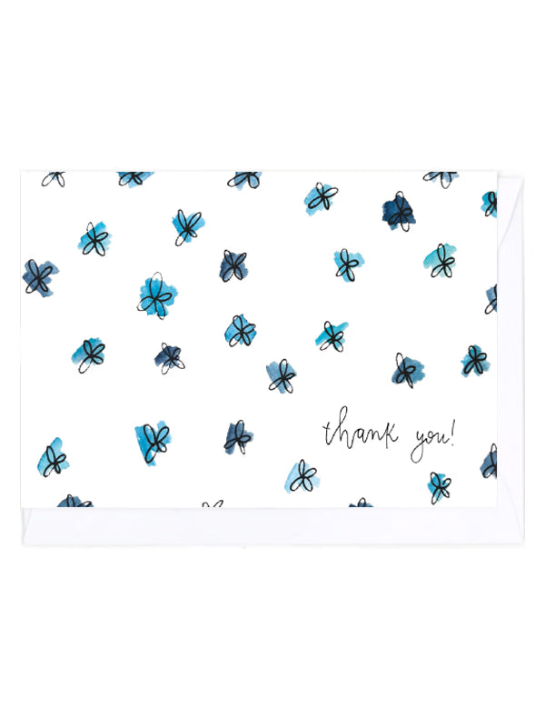 Greeting card with a pattern of blue flowers and 'thank you!' text on a white background