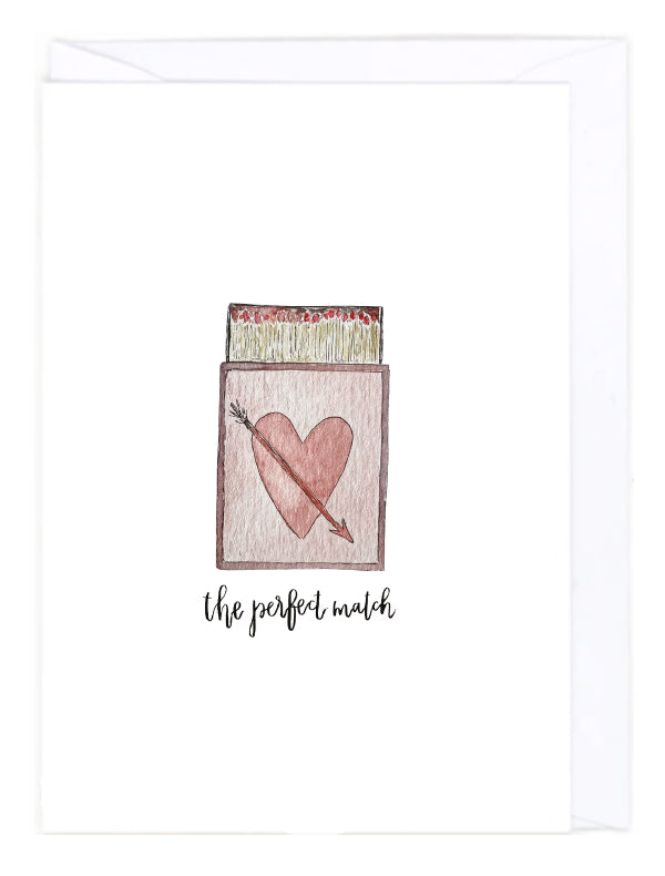 Greeting card with a matchbox with a heart and arrow design and text 'the perfect match' on a white background