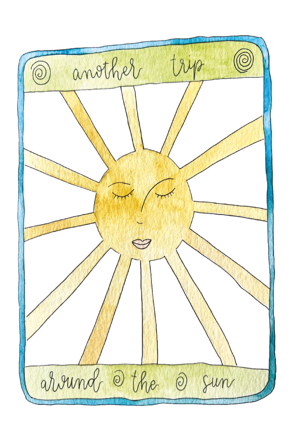 Illustration of a sun with facial features and text 'another trip around the sun' on a white background.