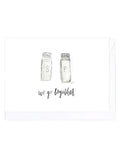 Card illustrated with two salt and pepper shakers on a white background, accompanied by the text 'We go together'.