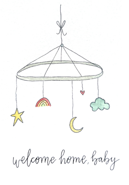 Baby mobile with stars, rainbow, moon, and cloud hanging from a string with 'welcome home, baby' text below.